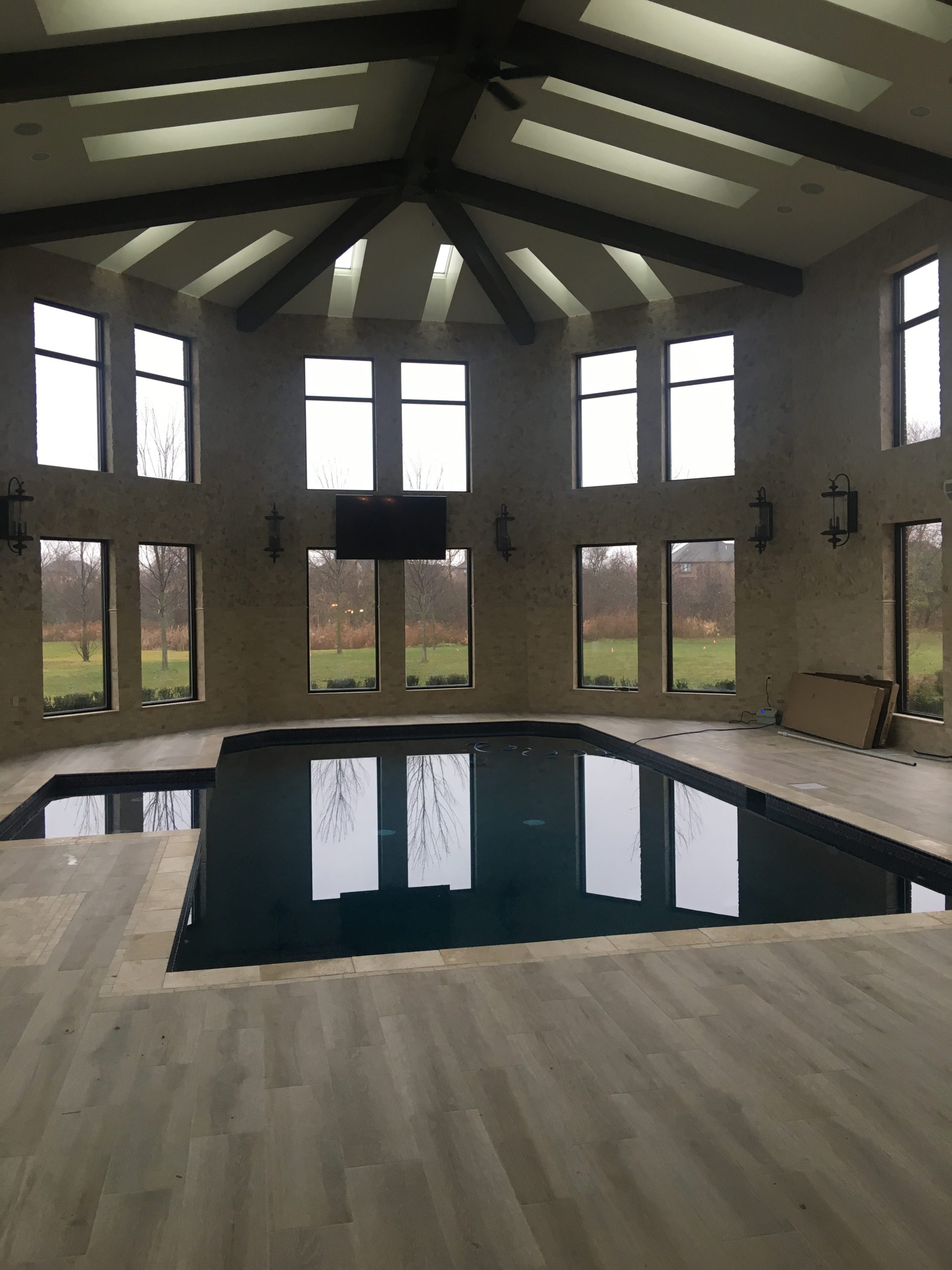 Indoor pool house with vaulted ceiling