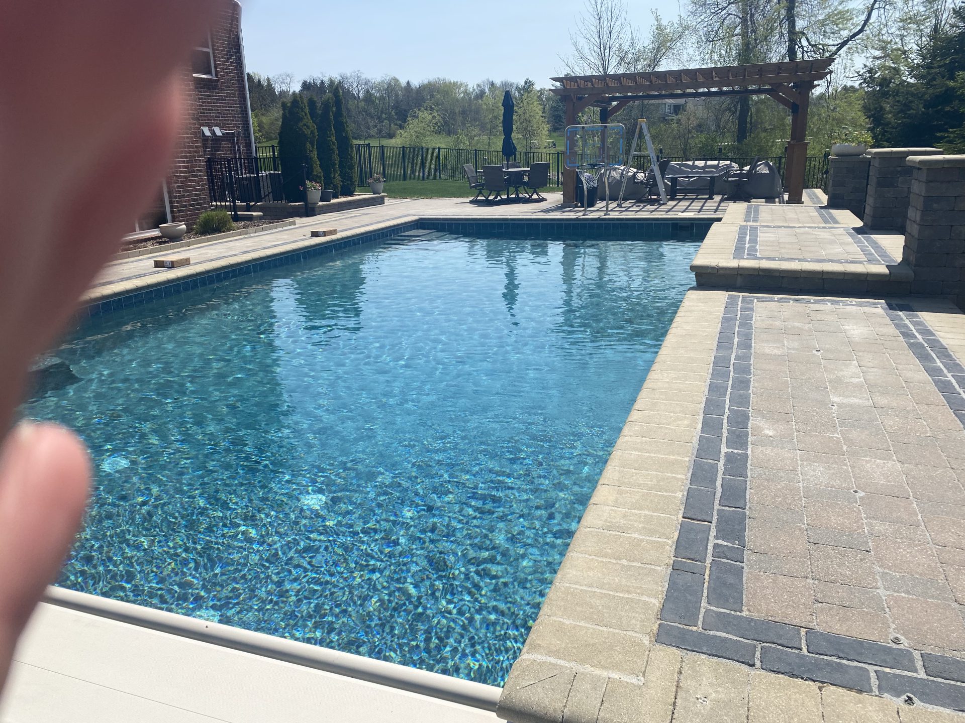 Backyard pool with pergola