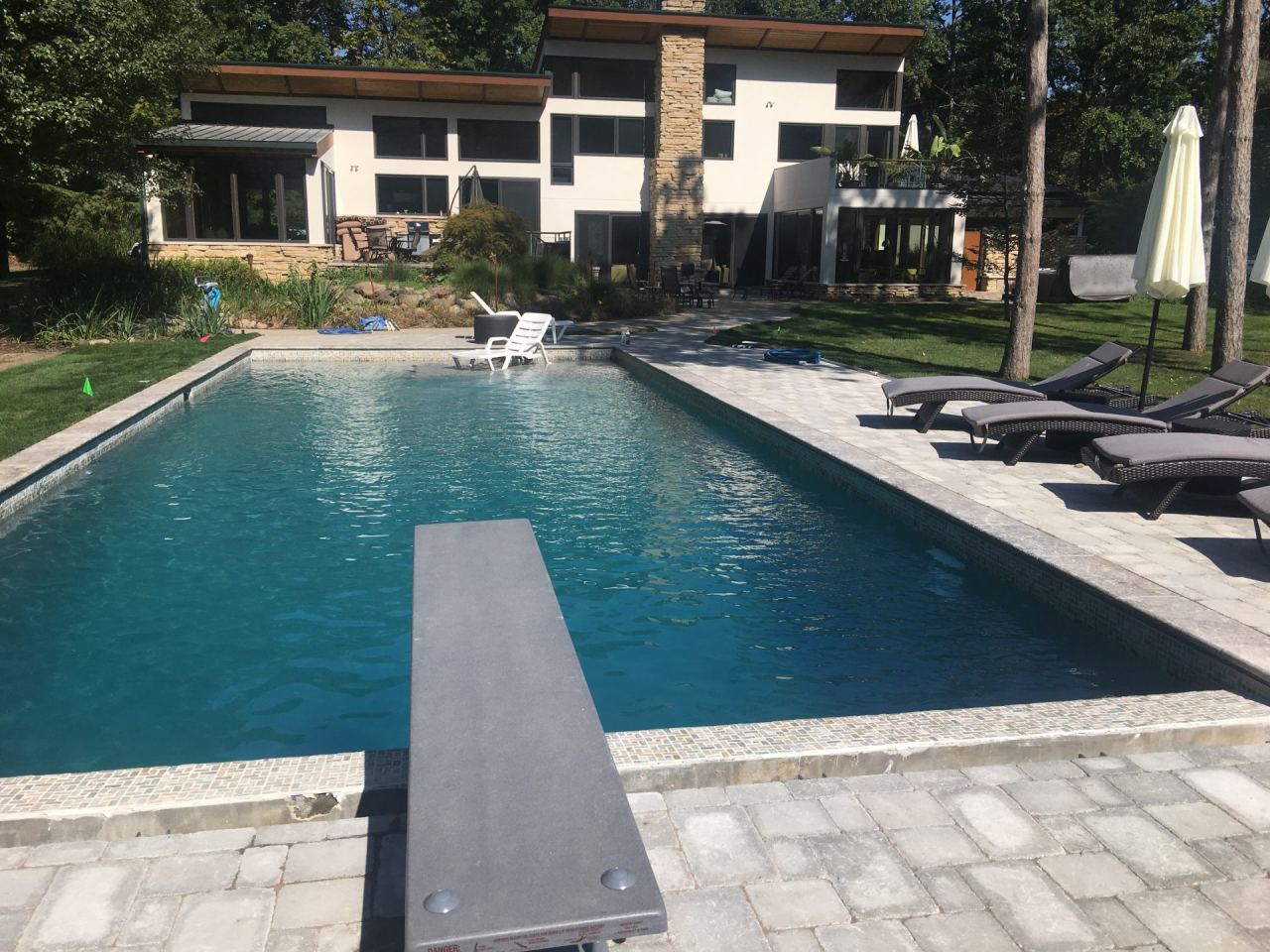 Modern gunite pool with diving board